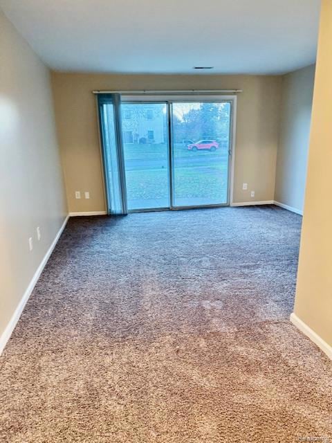 Carpeted spare room with plenty of natural light