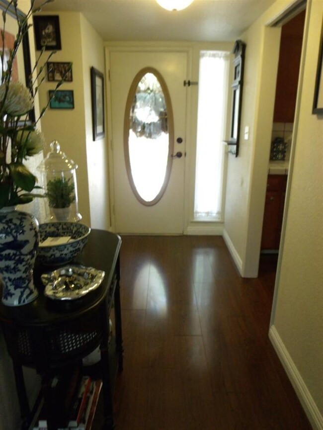 LOOKING BACK AT ENTRY FOYER FROM LIVING ROOM. LOTS