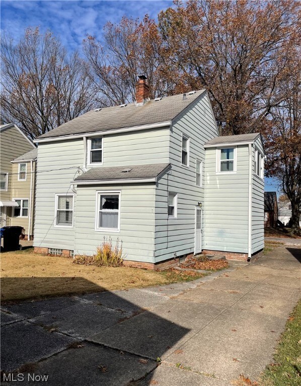 Back of house with side door entrance.