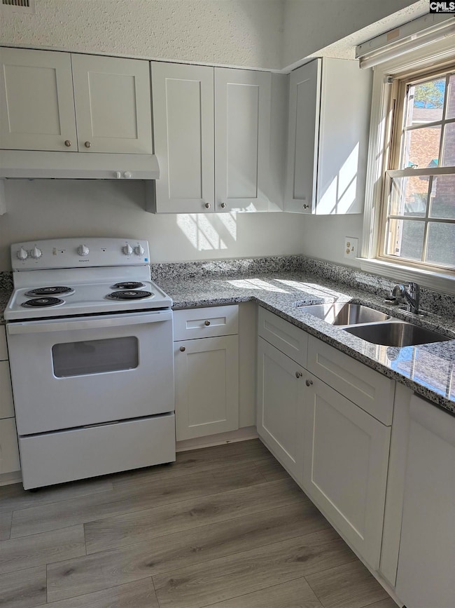 Kitchen has new flooring, countertops and Range & Dishwasher