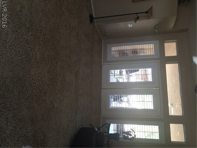 FORMAL LIVING ROOM LEADING OUT TO PATIO