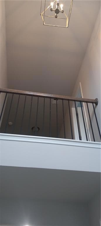 Stairs with an inviting chandelier