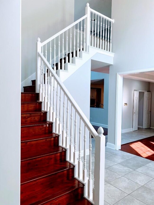 Staircase that leads to 2 bedroom upstairs and a g