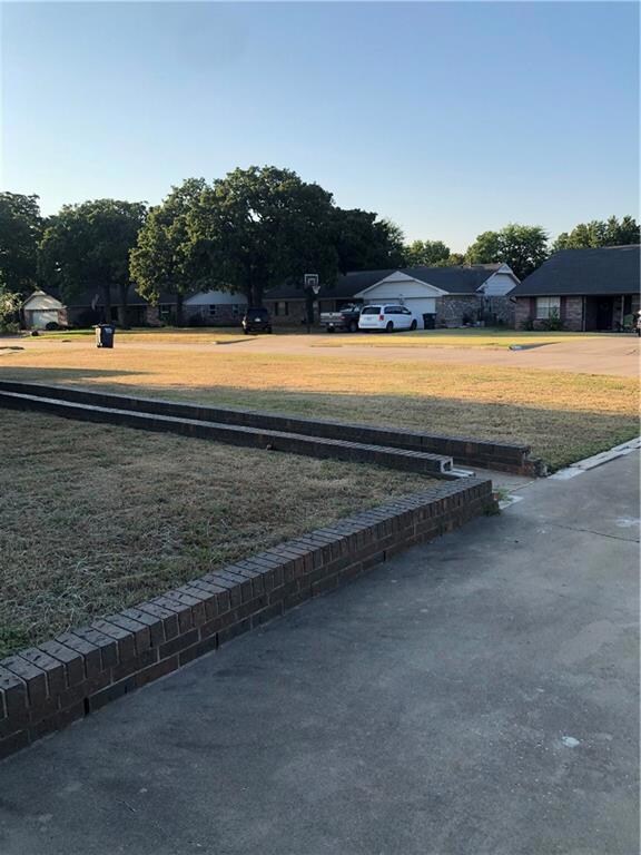 Front yard.  There is large yard area other side of circle driveway.