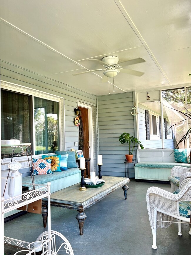 Screened porch at front of home