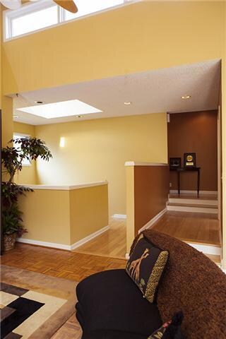 Another view of the great room which displays the stairway to the lower level.