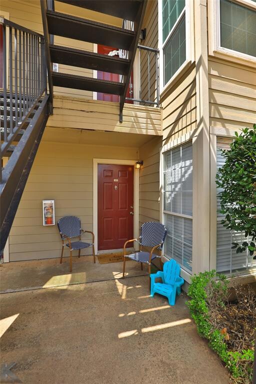 Covered sitting porch is great to relax on and enjoy the shade in the evening.