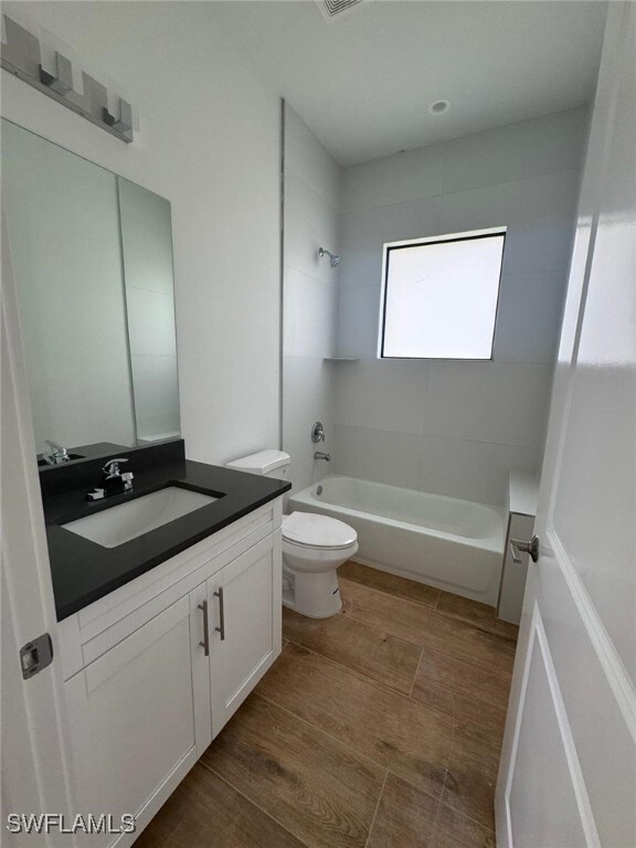 Bathroom with bathtub / shower combination, toilet