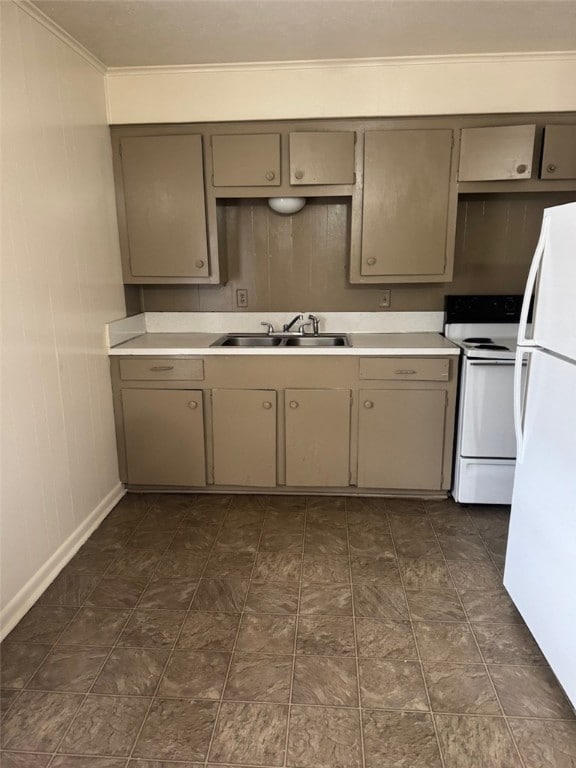Kitchen with white appliances, a sink, gray cabine