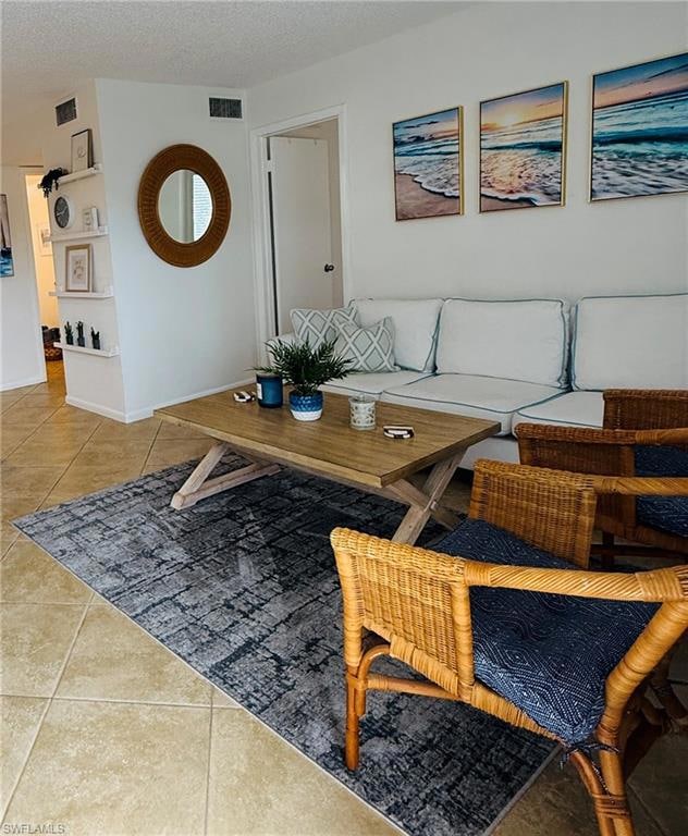Living room featuring light tile patterned floorin