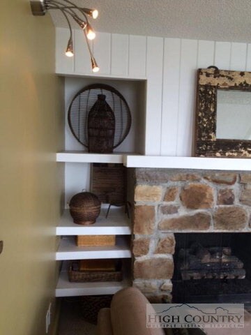 Sleek silver lighting fixtures and hardware.