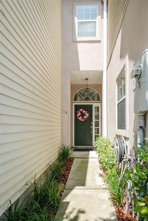 Walkway flanked by bedded plants welcomes as one a