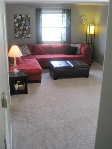 This cozy family room is perfect for movies, popcorn & board games! Built in bookshelves & fireplace on opposite side of room and brand new energy efficient window with screen. 