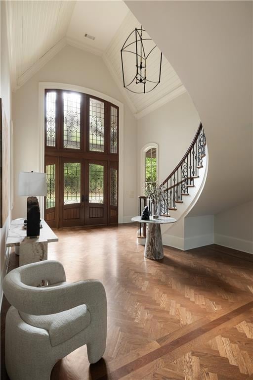 Herringbone inlaid foyer entry | Dramatic stair