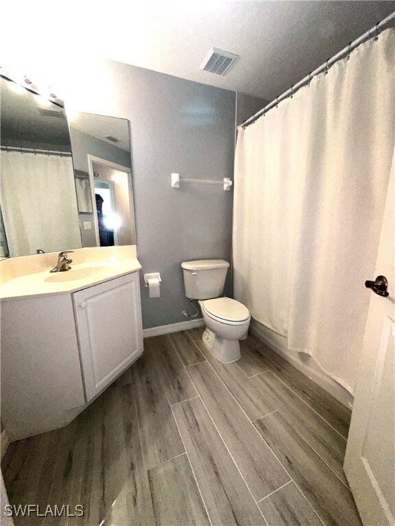 Bathroom with vanity and toilet