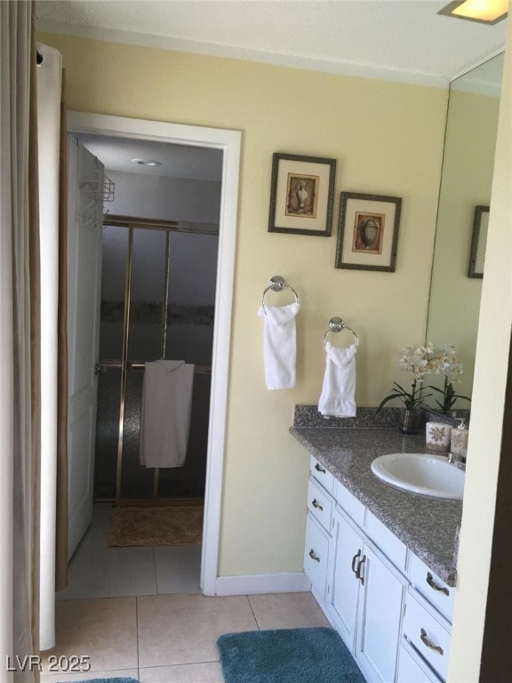 Full bath featuring a shower stall, baseboards, va
