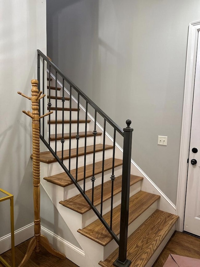Stairs in foyer up to main living. Door is to one