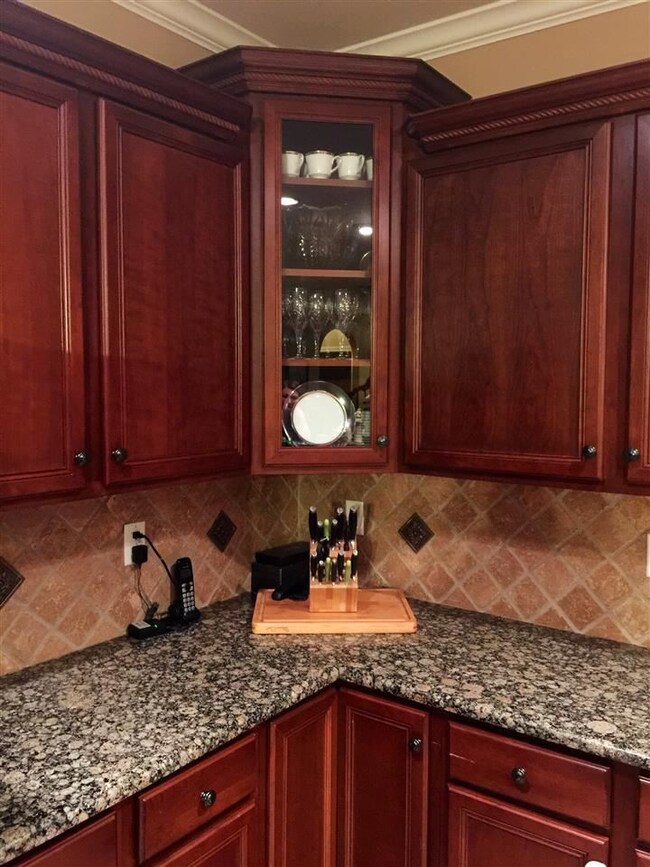 Beautiful glass front cabinet adds classic storage