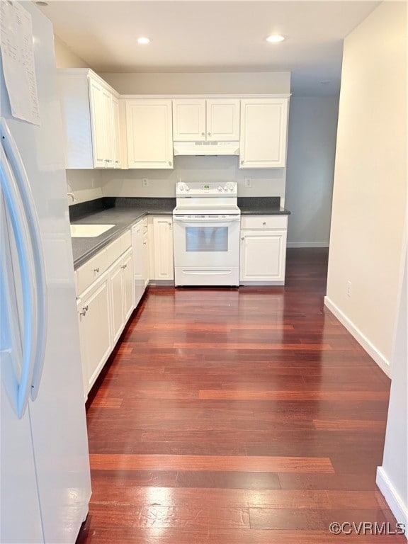 Kitchen featuring range, fridge, ventilation hood,