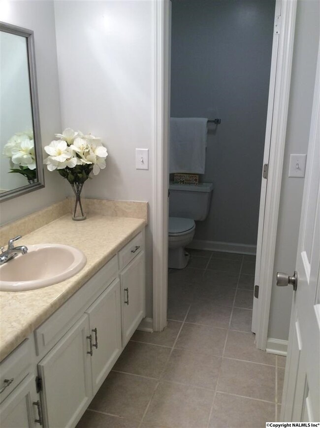 This spacious bath is off of the hallway and has the super ability to be closed off in the shower area when needed, it has access to bedroom 2. This is an oversized bathroom area as there is also the laundry closet concealed here .