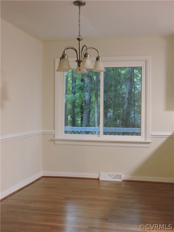 Eat-in kitchen overlooks wooded rear yard.