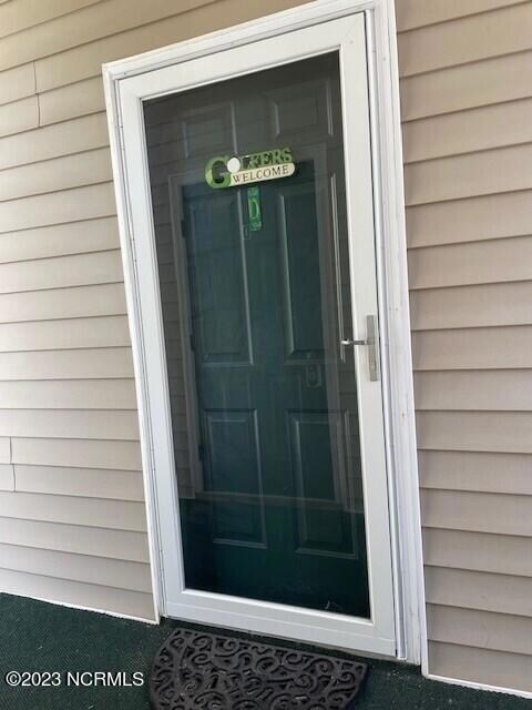 Front door and newer Pella storm door