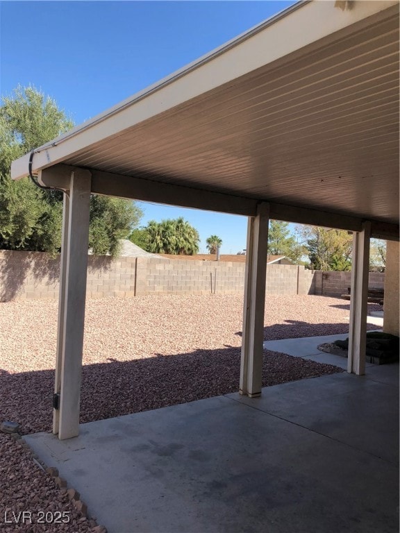 Fenced backyard with a patio area