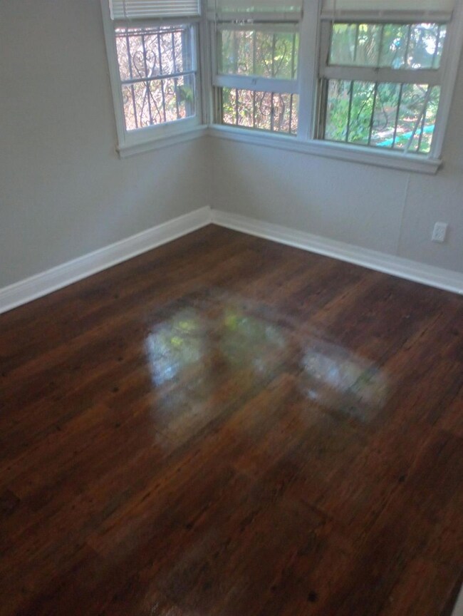 Spare room featuring plenty of natural light and d