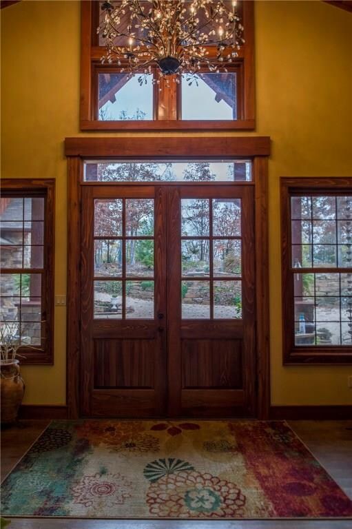 Entry way, custom chandeliers. looking out to fabulous landscaping.