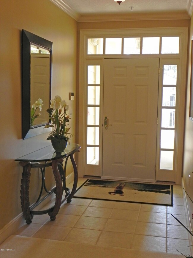 Foyer with Crown Molding & Tile Flooring