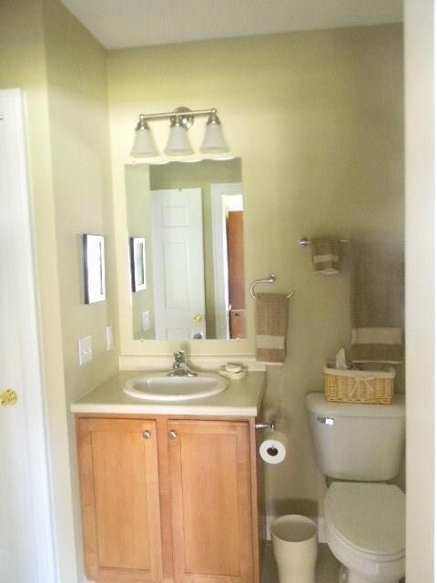 Guest bathroom with slider door to...