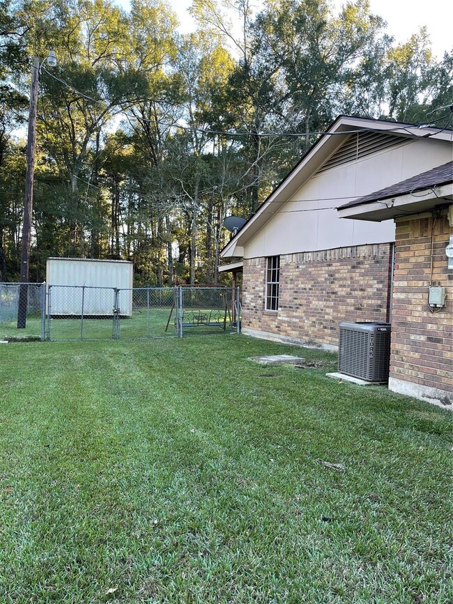 View of yard with central AC unit
