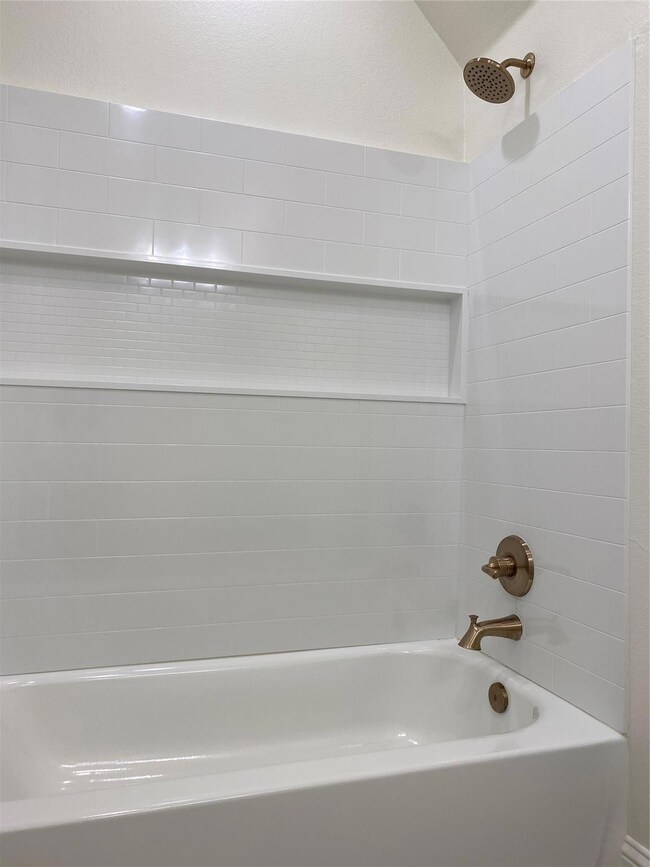 Full bath featuring tub / shower combination