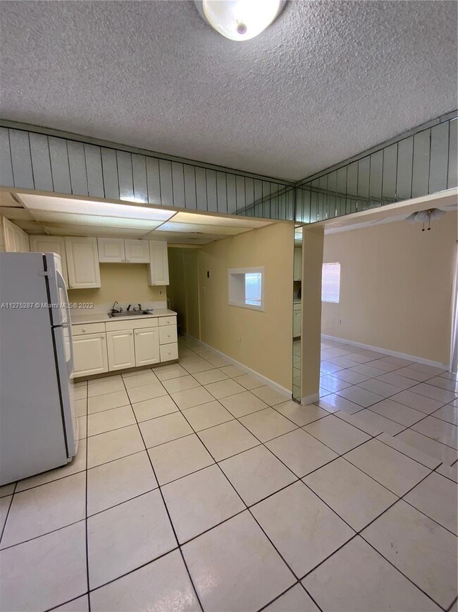 Kitchen entrance to laundry & pantry