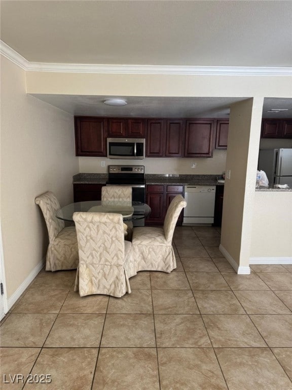 Dining room featuring crown molding, light tile pa