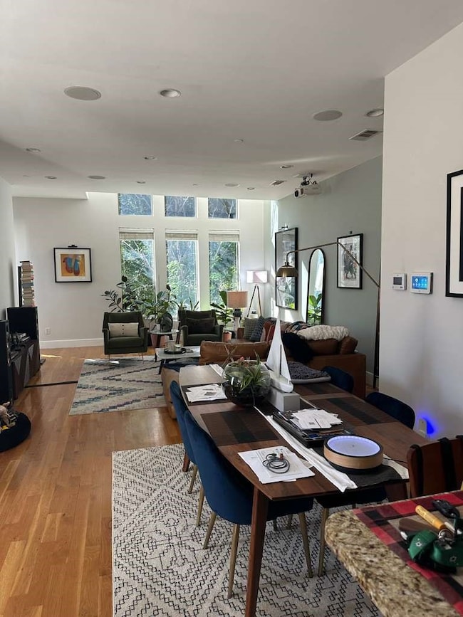 Dining room with wood finished floors and​​‌​​​​‌​​‌‌​​‌​​​‌‌​​​​​​‌‌‌​​‌​​‌‌​​​‌ baseboards