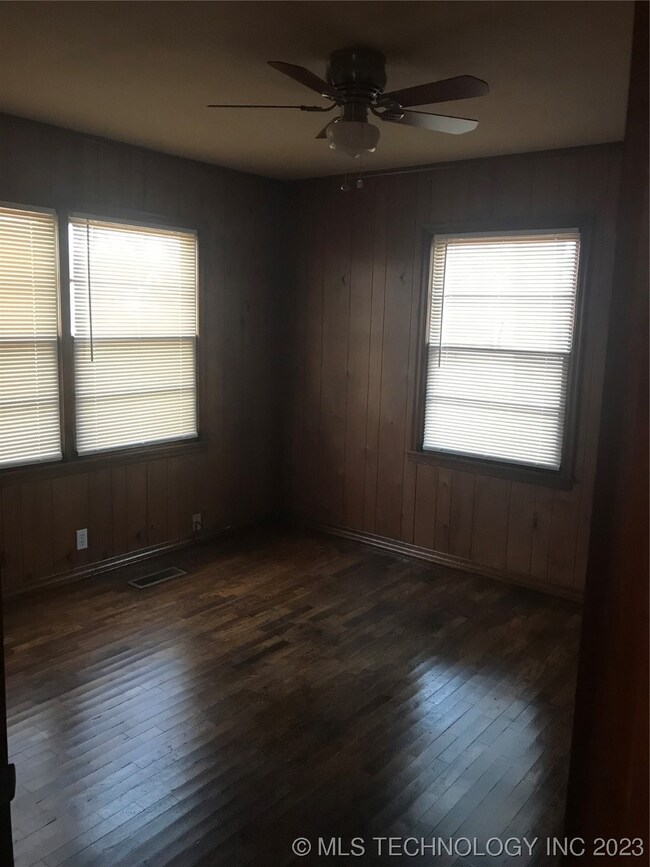 Front bedroom has original refinished hardwood flo