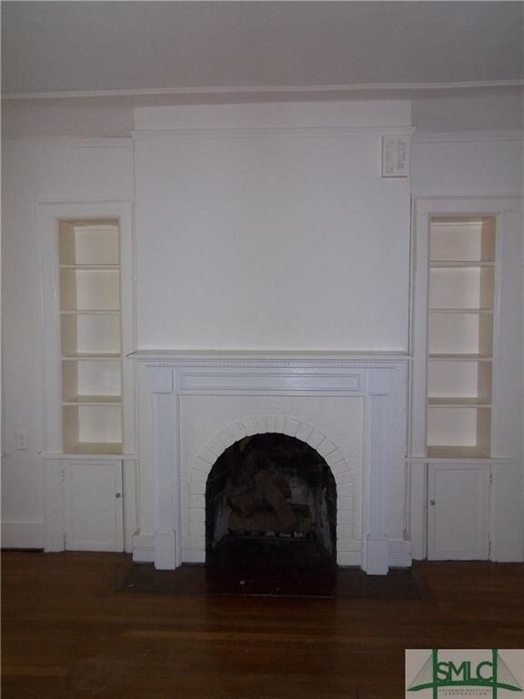 Living room fireplace and built-in bookshelves