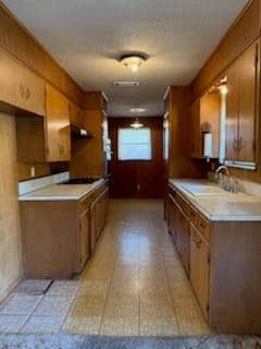 View of exterior entry with a garage