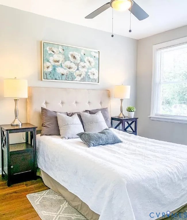 Bedroom featuring wood finished floors and ceiling fan