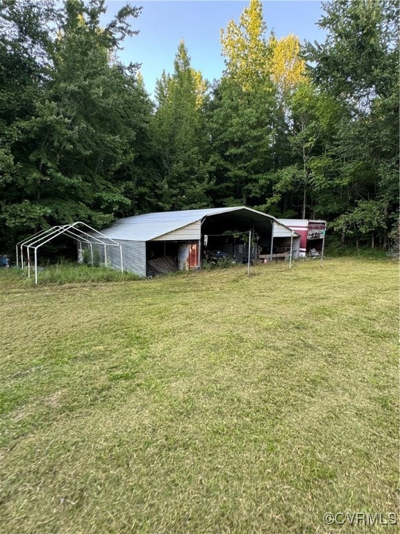 View of yard with an outbuilding