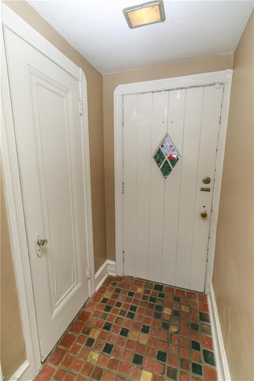 Ceramic Foyer with Guest Closet & Decorative Vintage Main Entry ...