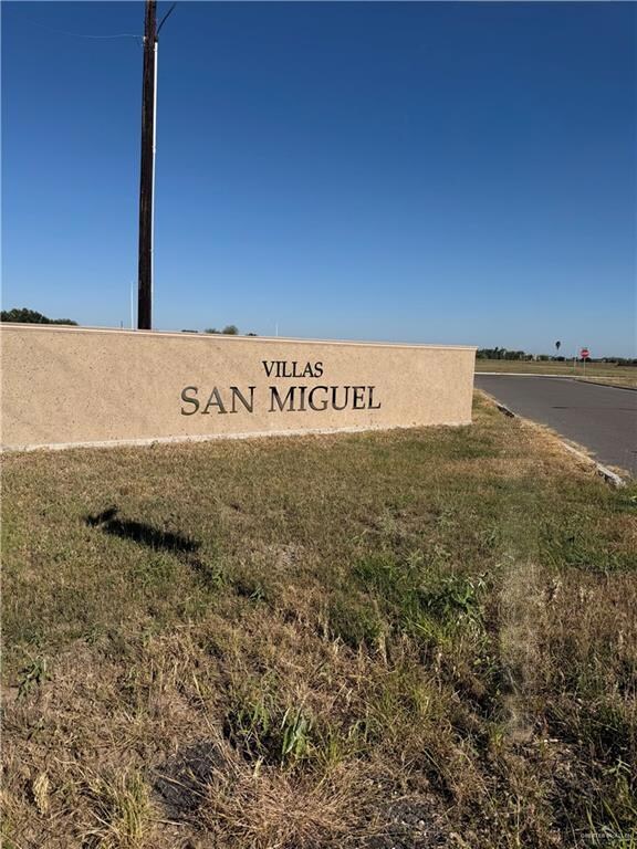 Community sign featuring a lawn