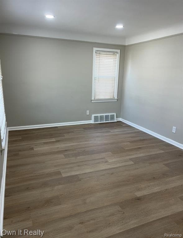 Unfurnished room featuring wood finished floors and recessed lighting