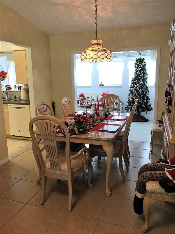 Open Living and Dining areas with Florida room.