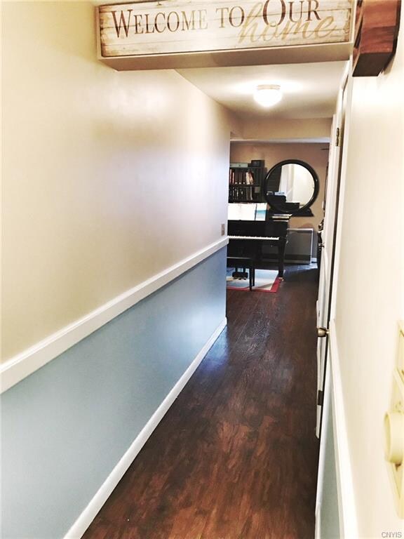 Entryway featuring brand new floors!