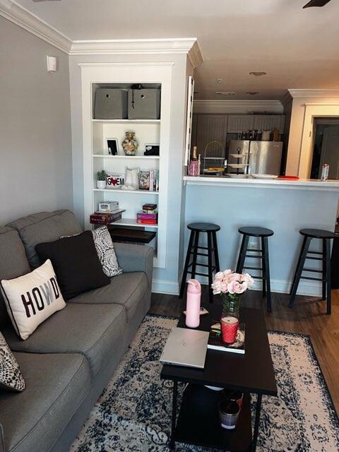 Living area featuring wood finished floors and or