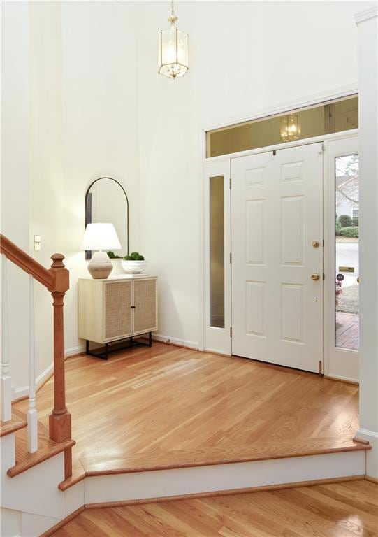 The bright and spacious foyer features hardwood fl