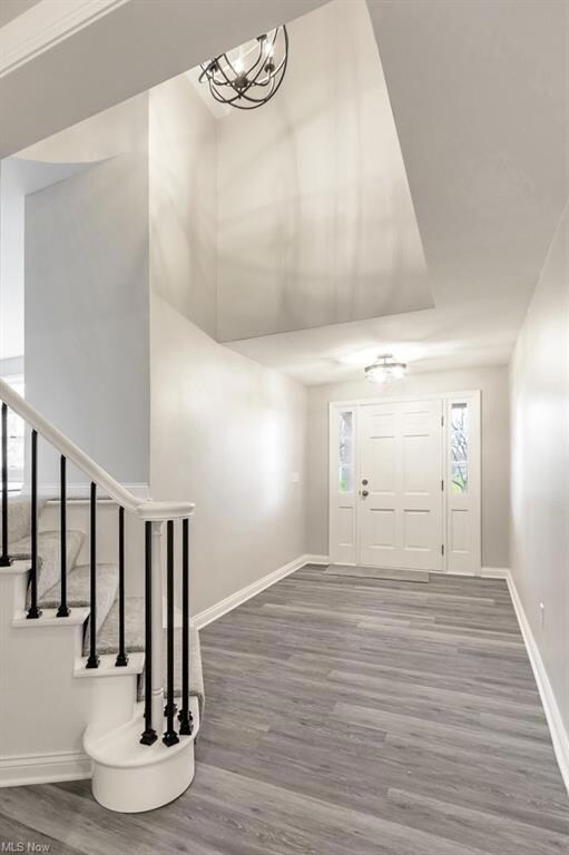 Gorgeous curved staircase , vaulted ceilings and p
