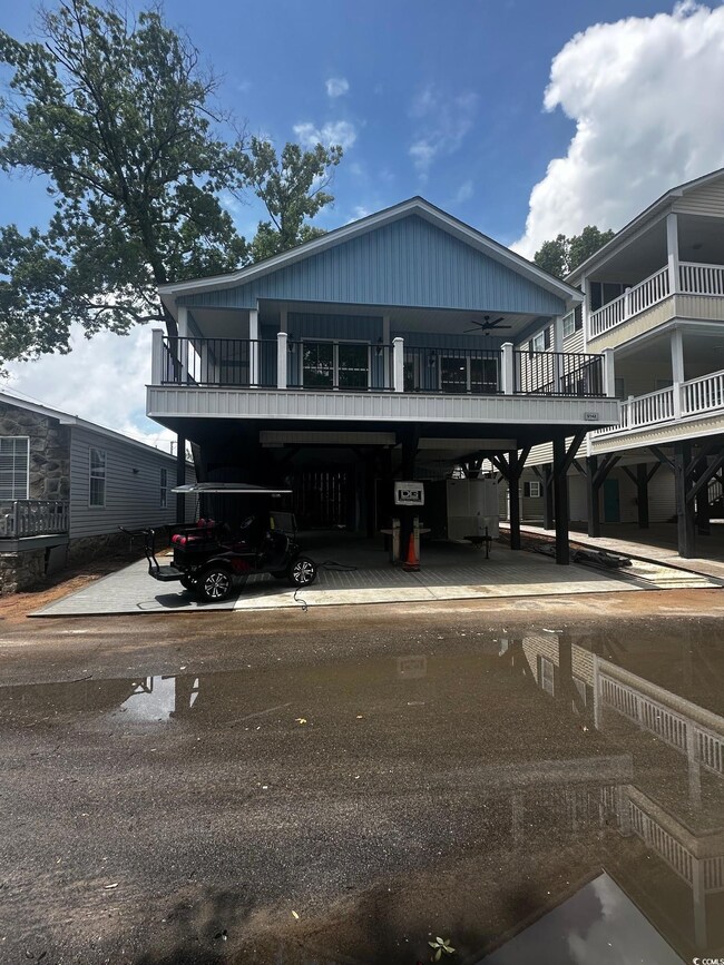 View of front of home featuring a carport